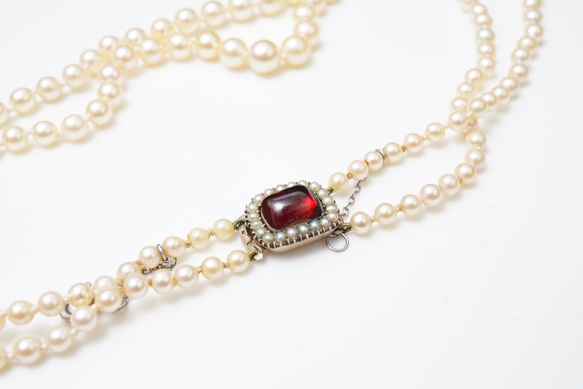 A cultured pearl and garnet necklace, 19th century and later